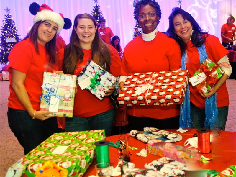 Wrapping New Toys for Girls and Boys in Need